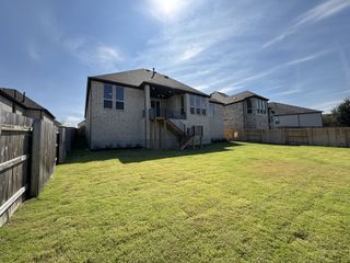 A charming two-story home with a spacious yard in Bryson by Highland Homes, Leander, TX.