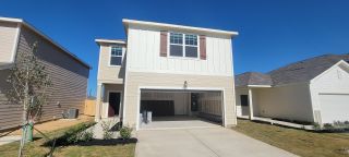 A modern two-story home with a clean facade and garage in Roosevelt Heights by Starlight Homes (San Antonio, TX).