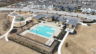 Community Amenities Charming community amenities with a pool and playground in Emory Crossing 50s by Taylor Morrison, Hutto, TX.