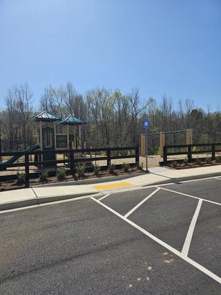 A charming community playground with vibrant equipment in Braselton Village by D.R. Horton (Braselton, GA).