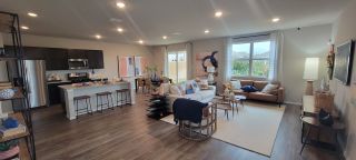 Model Home A spacious living area with modern decor, open layout, and ample natural light.