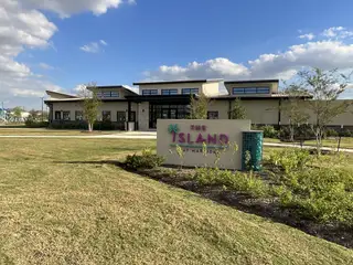 Modern community center with ample landscaping in Marvida Trails South by KB Home (Cypress, TX).