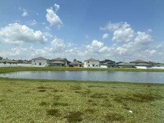 Street view Charming lakeside homes in Triple Creek: The Executives by Lennar, nestled in serene Riverview, FL.
