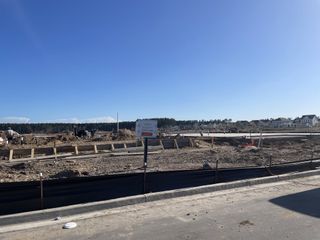 A developing construction site in Nexton by Homes by Dickerson, Summerville, SC, showcasing future neighborhood expansion.
