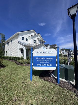 A charming two-story home with manicured landscaping in Crosswinds at Nocatee by Riverside Homes (Ponte Vedra Beach, FL).