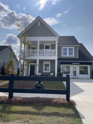 A charming two-story home with a welcoming porch in Sweetgrass at Summers Corner: Arbor Collection by Lennar (Ridgeville, SC).