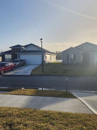 A charming neighborhood with clean streets and beautiful homes in Summerglen by Adams Homes (Jacksonville, FL).