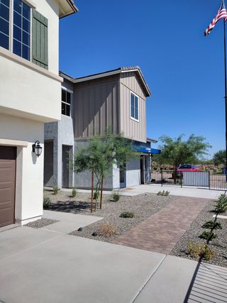 A modern home with clean lines and a desert landscape in Greenpointe at Eastmark by Landsea Homes (Mesa, AZ).
