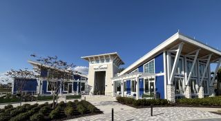Community Amenities A modern blue and white pavilion with sleek architecture in Meridian Parks by Mattamy Homes (Orlando, FL).