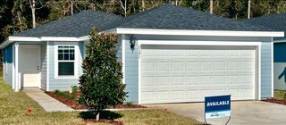 Street view A beautiful, move-in-ready home with a two-car garage and modern curb appeal in Kings Crossing by Meritage Homes (Jacksonville, FL).