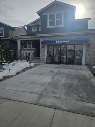 A modern brick home with a sleek entrance in Harvest Ridge: The Monarch Collection by Lennar (Aurora, CO).