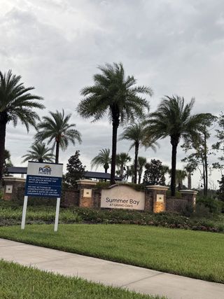 Street view A lush entrance with palm trees welcomes you to Summer Bay at Grand Oaks by Pulte Homes in St. Augustine, FL.
