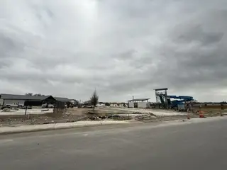 Community amenities under construction with a modern slide in Riverstone at Westpointe by D.R. Horton (San Antonio, TX).