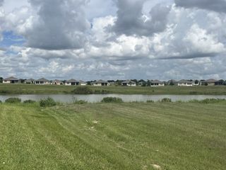 Street view Scenic homes with serene lake views in JB Ranch by D.R. Horton, Ocala, FL.