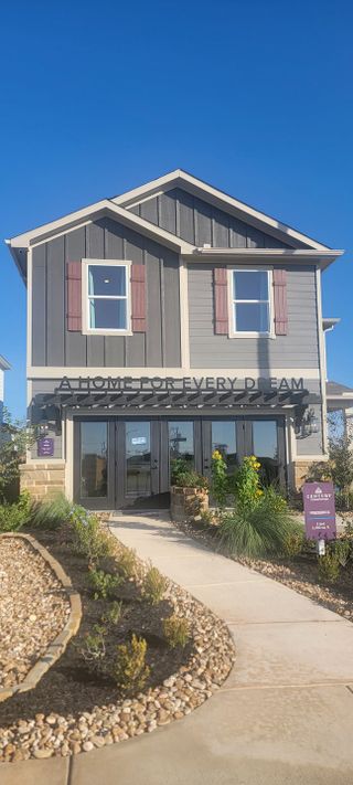A modern two-story home with charming shutters and landscaped entry in Applewhite Meadows by Century Communities (San Antonio, TX).