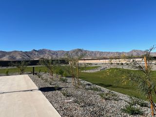 Scenic desert landscape with mountain views and landscaped surroundings in Windrose by Brightland Homes (Waddell, AZ).