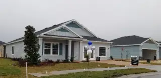 Street view Charming light blue home with inviting porch in Heath Preserve - The Enclave by Lennar, Ocala, FL.