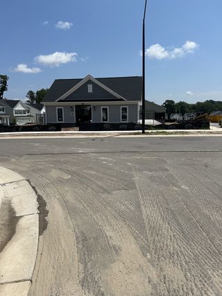 Street view A charming single-story home with a welcoming porch in Harlowe Point by Lennar (Durham, NC).