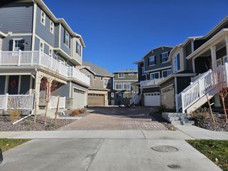 Modern homes with elegant balconies and garages in Erie Highlands by Oakwood Homes Co (Erie, CO).