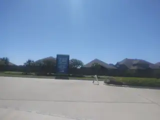 Street view Welcome to Lago Mar by M/I Homes in La Marque, TX. Discover serene suburban living with scenic views and inviting streets.