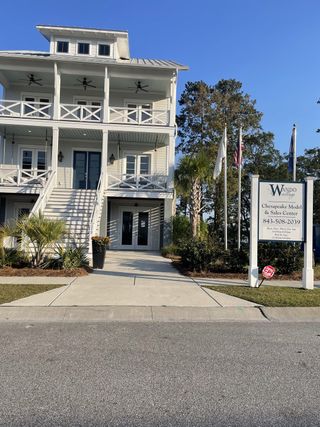 A charming coastal home with spacious balconies in Wando Village by John Wieland (Charleston, SC).