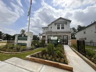 A modern two-story home with manicured gardens in Aldine Pines by Saratoga Homes, Houston, TX.