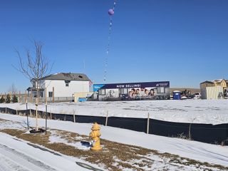 A new development in Legato by Century Communities, featuring modern homes amidst snowy Commerce City, CO.