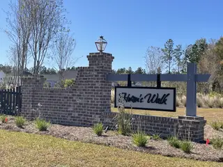 Street view Charming brick entrance sign for Heron's Walk at Summers Corner: Row Collection by Lennar in Ridgeville, SC.