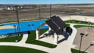 A vibrant community park with a basketball court and shaded pavilion in Cielo Gardens: Welton Collection by Lennar (Jarrell, TX).