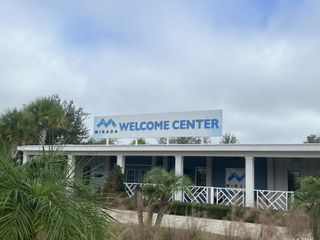 Street view A welcoming entrance to the Mirada Active Adult community, with modern design elements by Lennar in San Antonio, FL.
