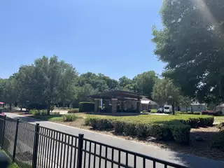 A charming pavilion and lush greenery in Ocala Preserve by D.R. Horton, Ocala, FL, offer serene surroundings.