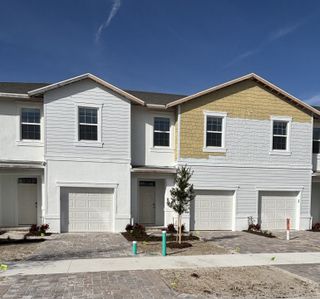 Modern townhomes with a clean facade in Central Park Townhomes by D.R. Horton, Port St. Lucie, FL.