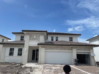 Elegant two-story home with tiled roof and modern facade in Crescent Ridge by Lennar (Davie, FL).