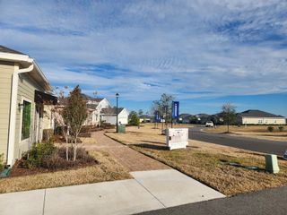Street view A welcoming residential street with manicured lawns in Granary Park by Lennar (Green Cove Springs, FL).