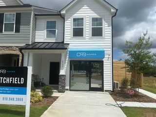 Street view Modern sales center with distinctive siding and trim in Battle Bridge by DRB Homes (Raleigh, NC).