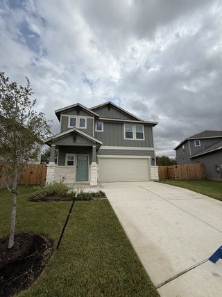 A charming home with a lovely front yard and clean design in MorningStar by Meritage Homes (Georgetown, TX).
