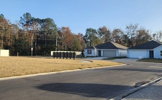 Street view A serene suburban street view with modern homes in Hawkes Meadow by KB Home (Jacksonville, FL).