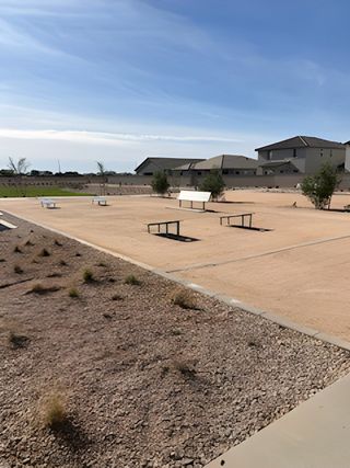Community Amenities Expansive outdoor area with benches in Wildera – Canyon Series by Landsea Homes, San Tan Valley, AZ.