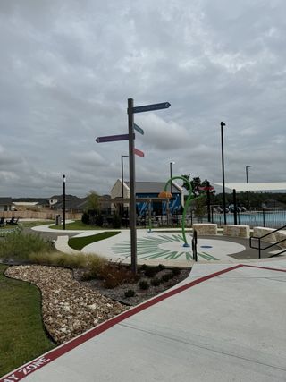 Community Amenities Family-friendly outdoor area with play zones, lush landscaping, and seating at Nolina - 60' by Westin Homes (Georgetown, TX).