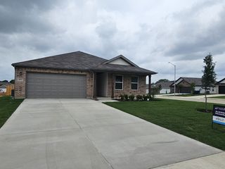 Street view A charming brick home with a spacious driveway in Middlefield Village by Century Communities, Dallas, TX.