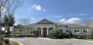 A beautifully designed clubhouse with modern furnishings and elegant lighting in Kindred by D.R. Horton (Kissimmee, FL).