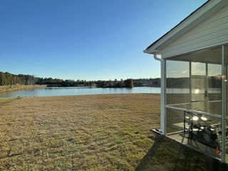 A serene lakeside home with a screened porch in Timothy Lakes by Center Park Homes (Ridgeville, SC).