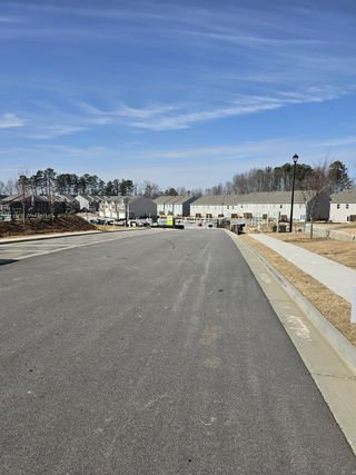 Street view A growing community with newly developed homes and spacious streets in Greyton Springs Place by D.R. Horton (Buford, GA).