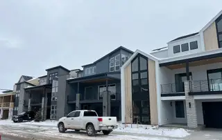 Street view Modern multi-level homes with sleek finishes in Lyric at Ridgegate by Infinity Properties (Lone Tree, CO).