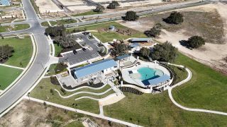 Community Amenities Community amenities with a pool and pavilion in Lariat by Ashton Woods, Liberty Hill, TX.