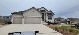A charming stone-accented home with a triple garage in Ventana: 70's by Monticello Homes (Bulverde, TX).