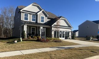 Street view A charming two-story home with a manicured lawn in Grier Meadows by Eastwood Homes (Charlotte, NC).