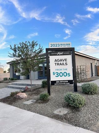 A modern home with elegant landscaping at Agave Trails by Ashton Woods in Buckeye, AZ.