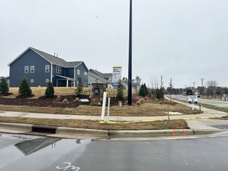 A contemporary gray home with landscaped surroundings in The Manors at Haywood Glen by D.R. Horton (Knightdale, NC).