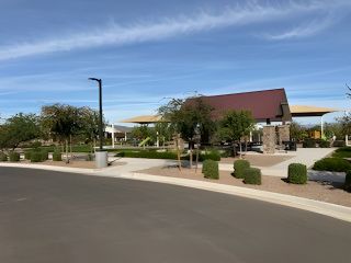 A vibrant community park with lush landscaping in Bella Vista Farms by Starlight Homes (San Tan Valley, AZ).